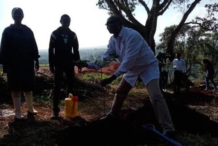 Dr. George Abong' leads the department in the tree planting exercise