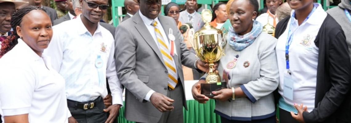 Deputy President  presenting a Trophy to VC UON at NITF 2024